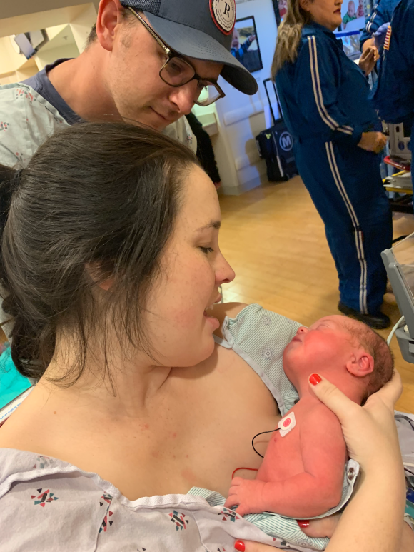 Mama holding Ben for the first time